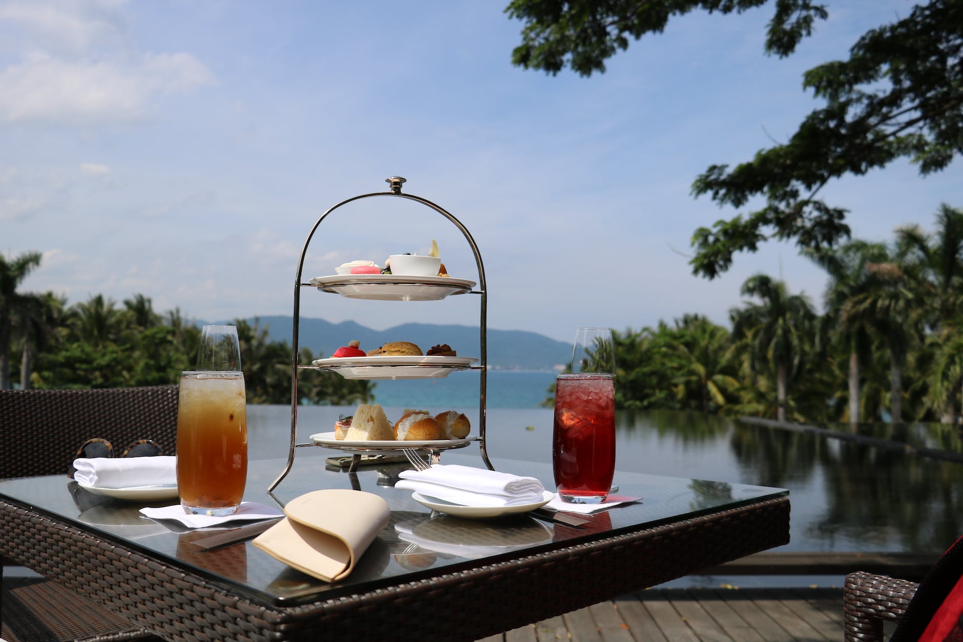 desserts and drinks served on table with lakeside view
