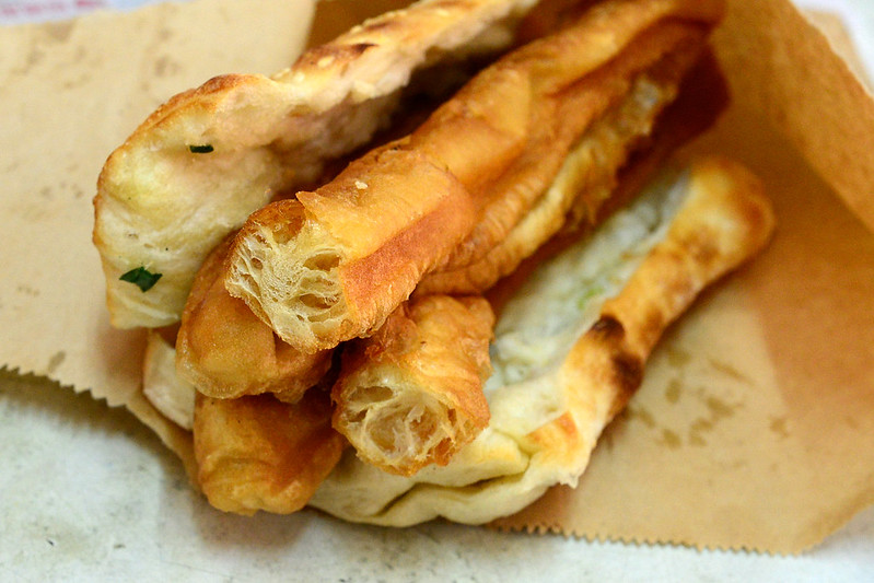 Crispy 油條 stuffed in an egg and sesame wrap